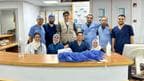 Dr. Ammar Ghanem, an ICU specialist from Detroit volunteering with the Syrian American Medical Society, third from left, poses with a local team of ICU nurses and staff at the European General Hospital on May 6 in Khan Younis, Gaza.