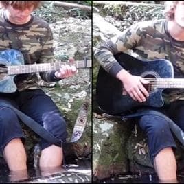 Australian Man's Calm Encounter With Massive Snake While Playing Guitar