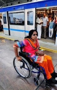 Passenger With E-Wheelchair Inside Delhi Metro